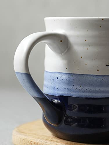 Close-up of a ceramic mug with blue and white glaze