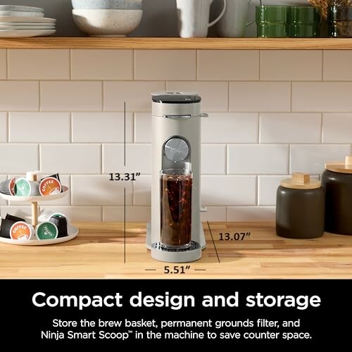 Compact coffee maker with storage and design dimensions