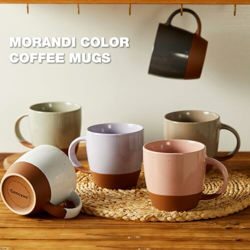 Assorted Morandi color coffee mugs on a wooden table.