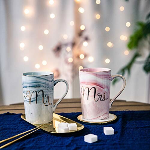 Mr and Mrs mugs on a table with bokeh lights in background